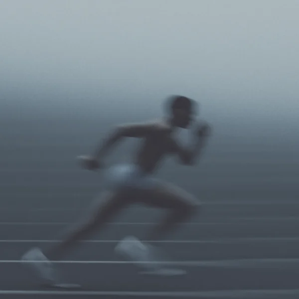 Tableau course à pied en mouvement — coureur lancé sur la piste, vitesse et flou artistique, art mural premium