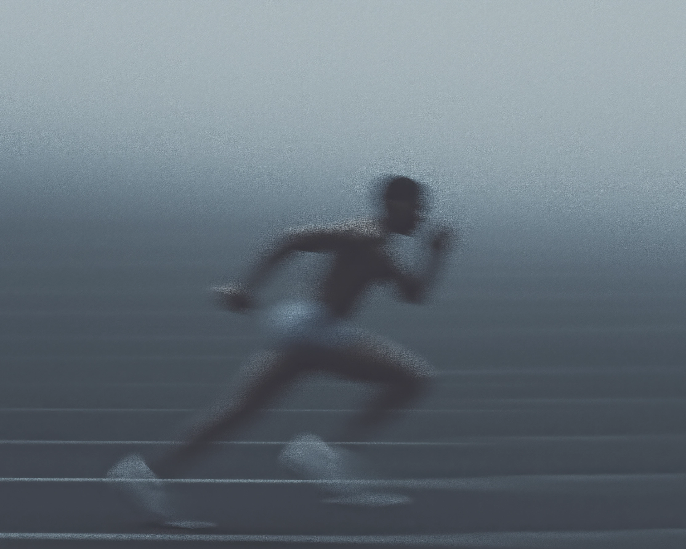Tableau course à pied en mouvement — coureur lancé sur la piste, vitesse et flou artistique, art mural premium