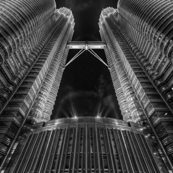 Tours Petronas Symétrie — tours jumelles de Kuala Lumpur en contre-plongée, façades métalliques géométriques, noir et blanc, art mural premium